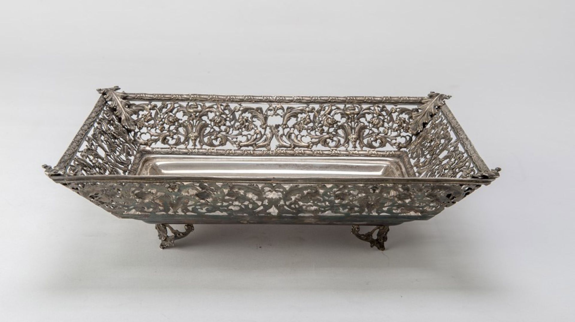 SILVER BASKET, PUNCH MILAN POST 1968 rectangular shape with edge pierced to vegetable motifs.