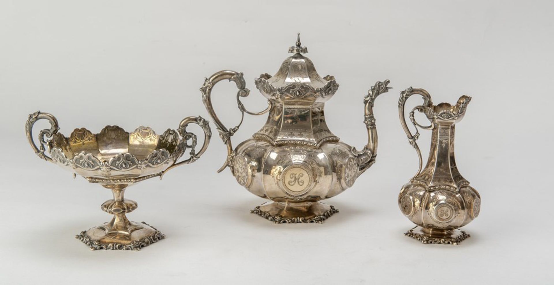 SILVER TEA SERVICE, PUNCH LONDON 1853 engraved with groups of flowers and leaves. Consisting of