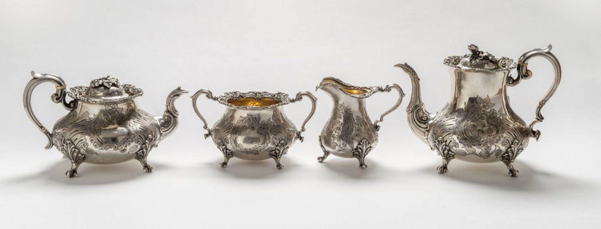 SILVER-PLATED TEA AND COFFEE SERVICE, EARLY 20TH CENTURY engraved with vegetable motifs, small