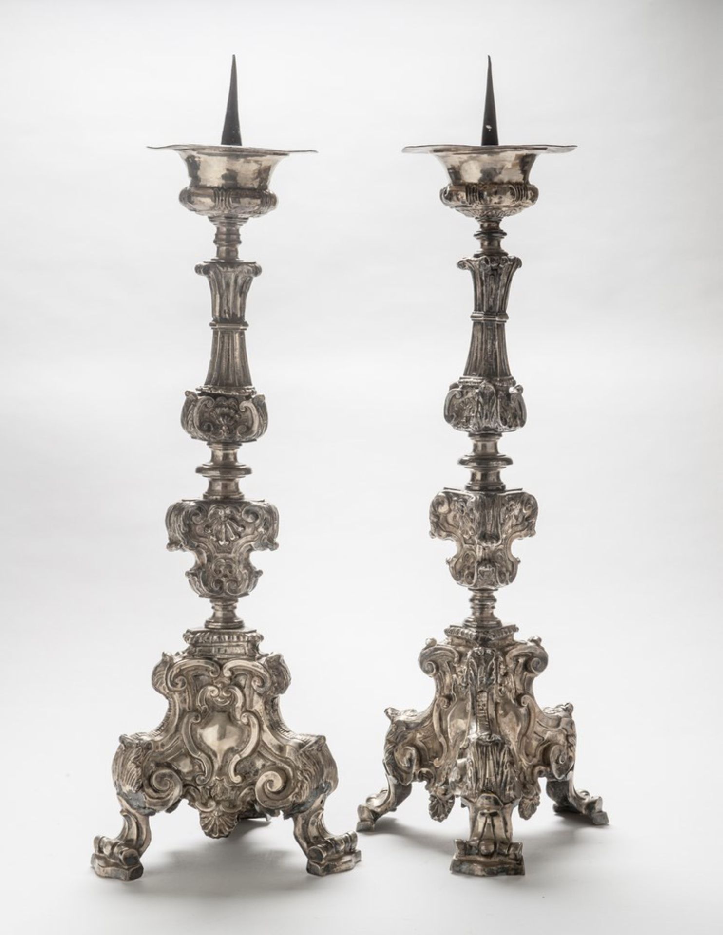 A PAIR OF SILVER-PLATED CANDLESTICK, NAPLES OR ROME 18TH CENTURY embossed to spirals, curls,