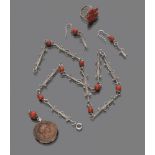 PARURE OF EARRINGS, CHOKER, RING AND PENDANT in silver and red coral. Pendant with ancient coin