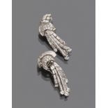 SPLENDID PAIR OF EARRINGS in platinum, embellished with round cut and baguette cut diamonds.