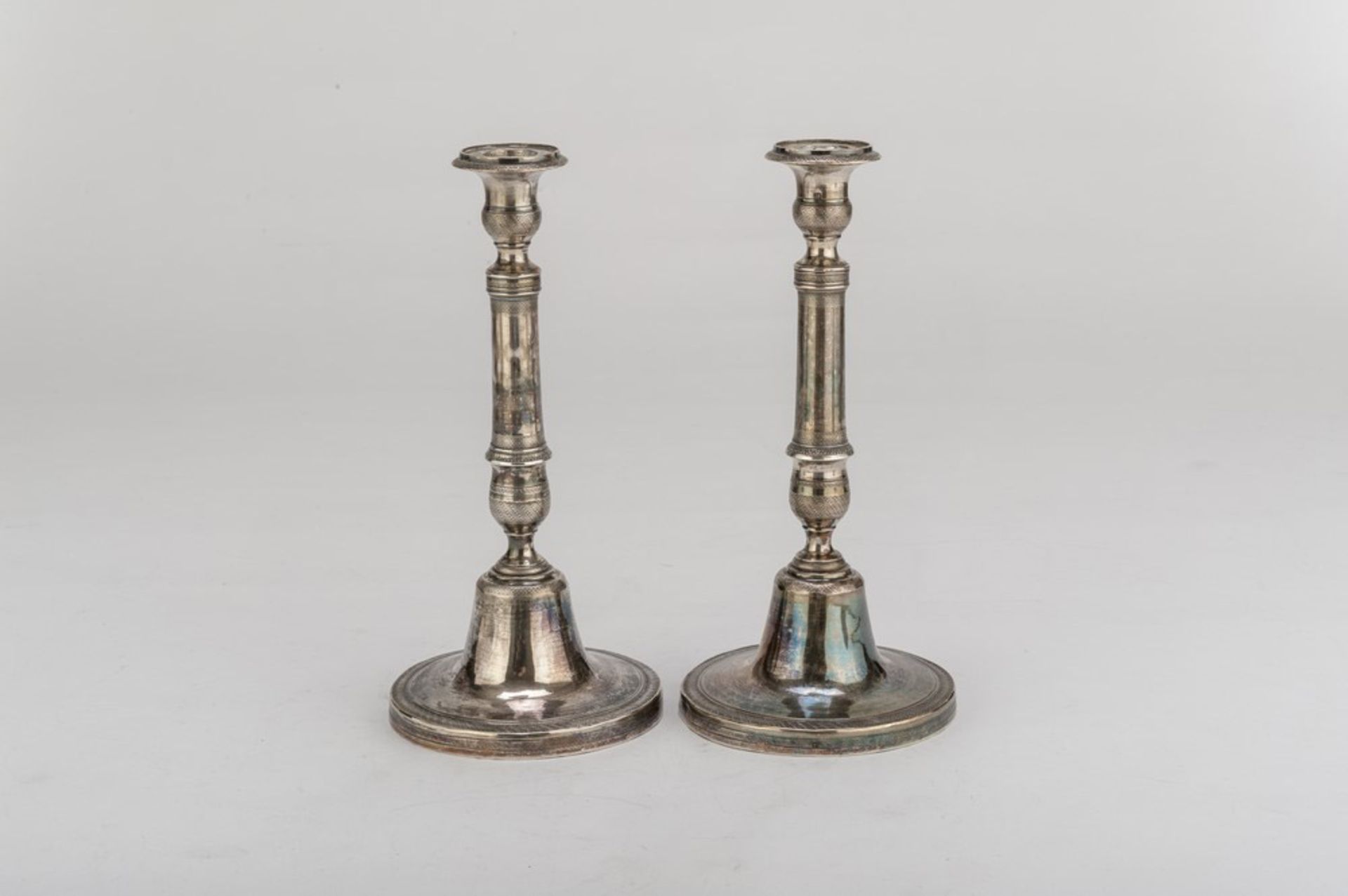 A PAIR OF SILVER CANDLESTICKS, NAPLES 1832/1872 edges to bee nest and palmettes. Circular