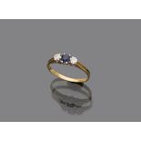 RING in yellow gold 18 kts., with central sapphire and two side diamonds. Diamonds ct. 0.16, total