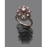 RING in white gold 18 kts., dome shape decorated with rubies and diamonds. Diamond ct. 0.40 ca.,