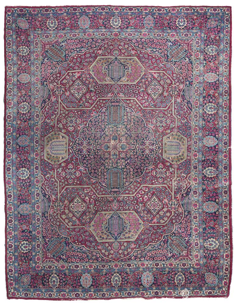 KIRMAN CARPET, MID 20TH CENTURY with a large central medallion on willows and 'Prophet's Flowers',