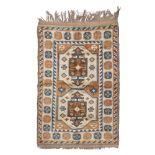 KARS CARPET, MID TWENTIETH CENTURY medallion with double niche in the central field at the bottom of