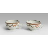 A PAIR OF PORCELAIN CUPS, 19TH CENTURY decorated with garlands and flowers. Not marked. Measures cm.