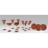 SERVICE OF GLASSES IN RUBY GLASS, VENICE EARLY 20TH CENTURY with golden decoration of leaves and