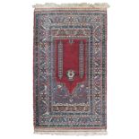 ANATOLIC MELAS CARPET, MID-20TH CENTURY with central prayer field with red ground and hem of oak