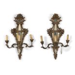 A PAIR OF GILTWOOD APPLIQUES, VENICE EARLY 20TH CENTURY of eighteenth-century style, with mirrors