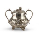 SILVER-PLATED SUGAR BOWL, EARLY 20TH CENTURY chiseled to leaves and flowers with pierced handles.