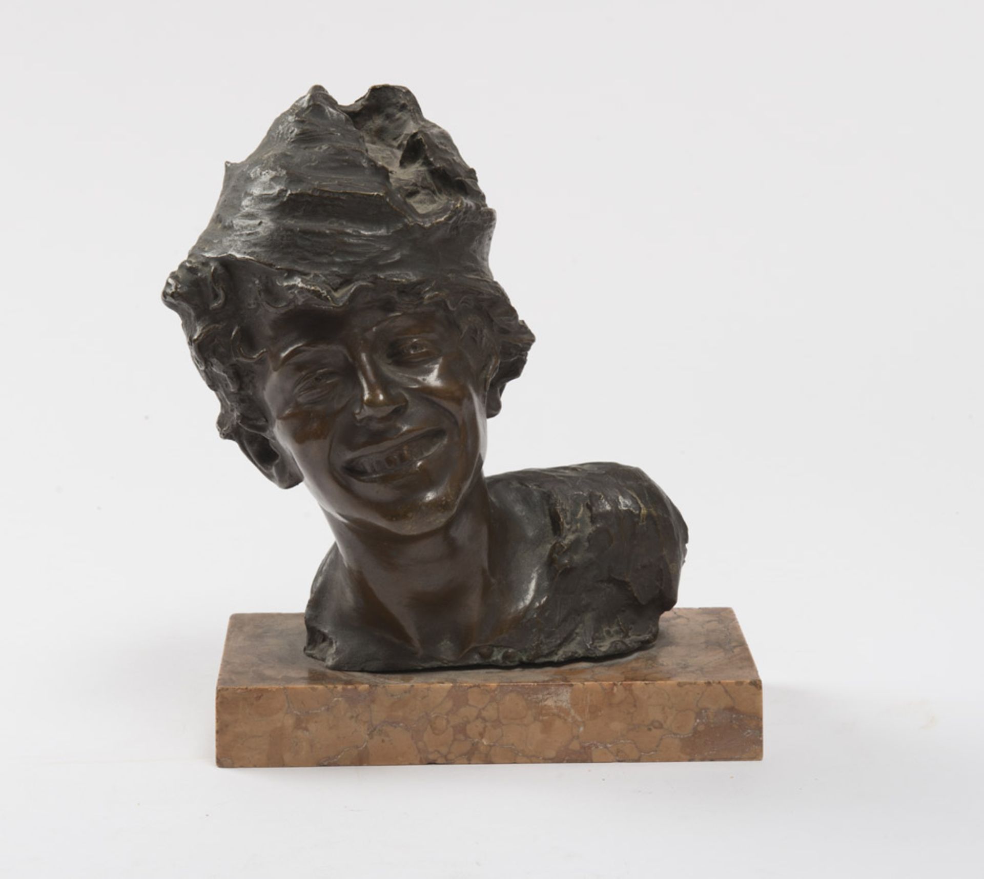 VINCENZO AURISICCHIO (Active in Naples, 19th-20th century) Bust of smiling urchin Lost wax casting
