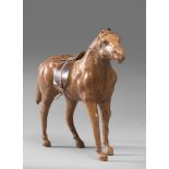 MODEL SKIN HORSE, 20TH CENTURY with stem in wood, in static laying. Measures cm. 28 x 9 x 42.
