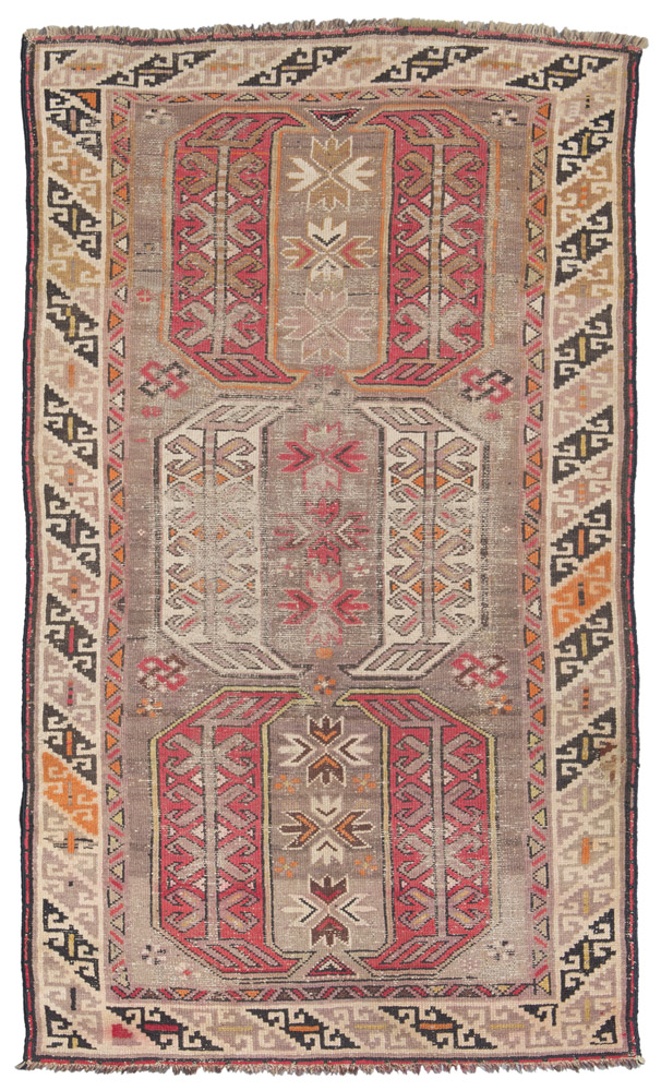 ANATOLIAN CARPET, LATE 19TH CENTURY with triple octagonal medallion to motifs of shoots with