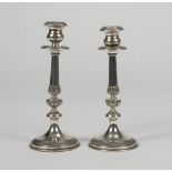 A PAIR OF SILVER CANDLESTICKS, PUNCH MILAN 1944/1968 h. cm. 21,5. Weighted. COPPIA DI CANDELIERI
