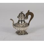 SMALL SILVER COFFEEPOT, NAPLES SECOLO embossed to pods, leaves and fruits. Wooden handle. Measures