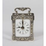 SILVER-PLATED TABLE CLOCK, GERMANY 20TH CENTURY frame chiseled to vegetable motifs. Measures cm.