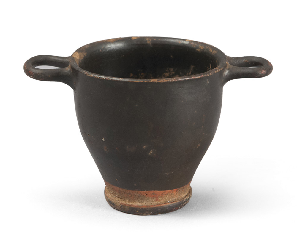 ATTIC BLACK-GLAZE KYPHOS, 5TH CENTURY B.C.