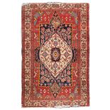 RARE CARPET FEHERAGAN, EARLY 20TH CENTURY medallion with shoots of flowers on white ground in the