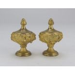 A PAIR OF KNOBS IN ORMOLU, 19TH CENTURY with body chiseled to leaves. Measures cm. 11 x 8 x 8.