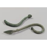 TWO BRONZE HANDLES, 7TH-6TH CENTURY B.C. vertical rod, with one end higher than protome ram and