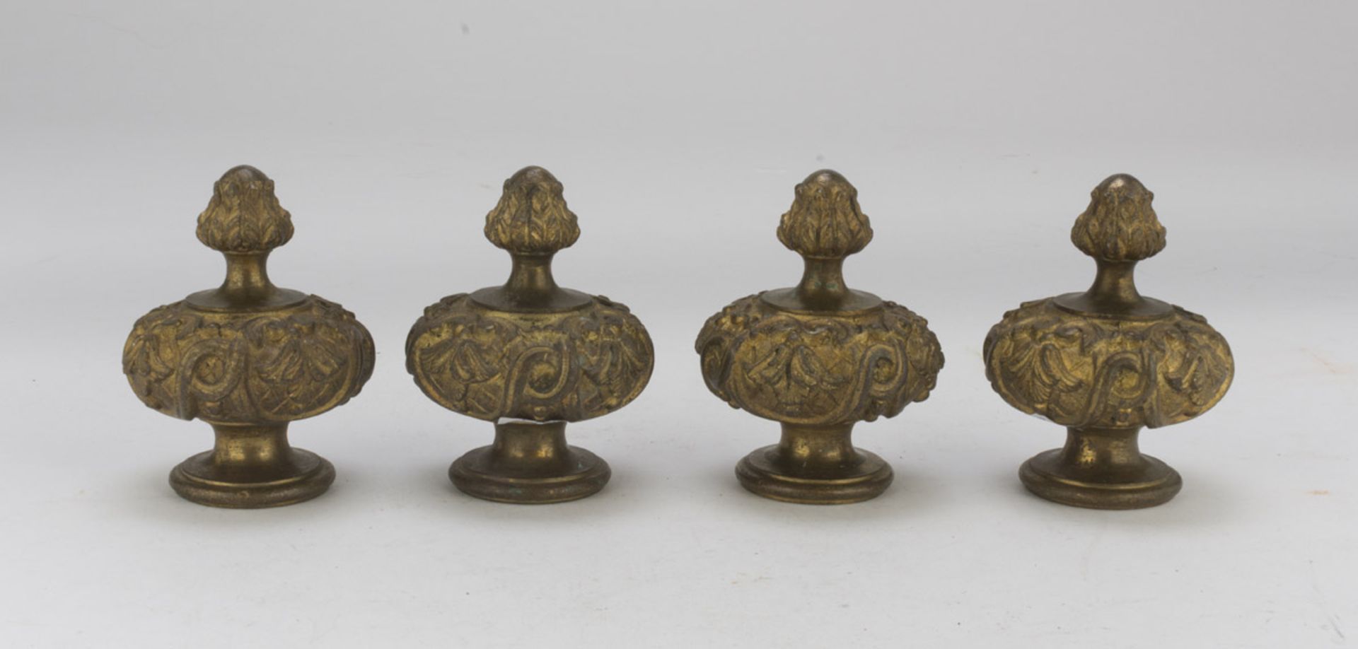 FOUR KNOBS IN ORMOLU, 18TH CENTURY called 'boules des escalier', chiseled to leaves and spiral.