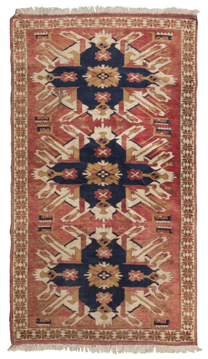 KAZAK CELABERD CARPET, EARLY 20TH CENTURY medallions with Eagles and secondary motifs of stylized