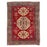 KAZAK CARPET, MID-20TH CENTURY to triple shield medallion and secondary motifs of simbologies in the