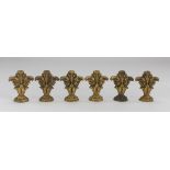 SIX SMALL FRIEZES IN ORMOLU, 19TH CENTURY chiseled to lock of leaves. Measures cm. 8,5 x 7 x 4.