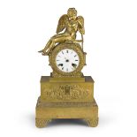 SMALL TABLE CLOCK IN BRONZE, FRANCE EMPIRE PERIOD with box to turret with figure of love on the hat.