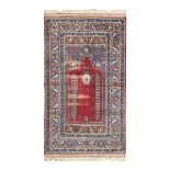 ANATOLIAN MELAS CARPET, EARLY 20TH CENTURY prayer design with red center field. Measures cm. 170 x