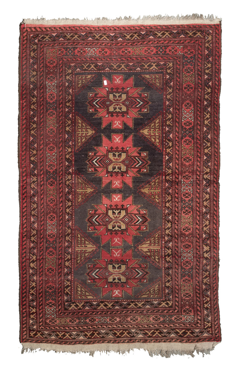 KAZAK STARS CARPET, MID-20TH CENTURY triple star medallion in the center field on blue ground.