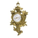 SMALL CARTEL CLOCK, END 19TH CENTURY in ormolu with case chiseled to motifs Luigi XV. Dial of