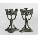 A PAIR OF METAL SHAFTS, EARLY 20TH CENTURY in green enamel, body with garlands, goat feet.