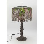 LAMP IN BRONZE, STYLE TIFFANY 1960s with lampshade in leaded colored glasses shaped to falling