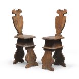 A PAIR OF WALNUT SEATS, TUSCANY 17TH CENTURY with lyre backs and polygonal seats. Flat and lobed