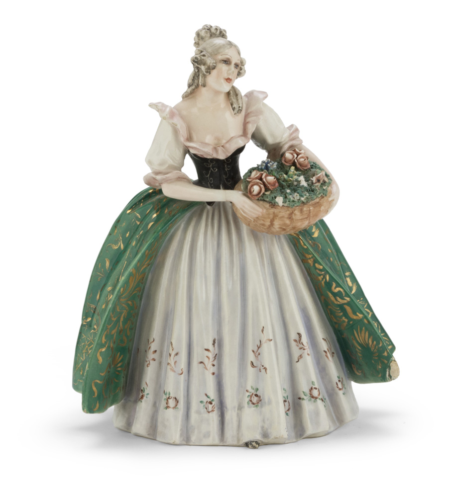 CERAMIC FIGURE, 20TH CENTURY in polychromy, representing young florist. Measures cm. 30 x 23 x 19.