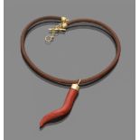 HORN OF FORTUNE PENDANT in red coral and yellow gold 18 kts., leather cord with clasp in yellow gold