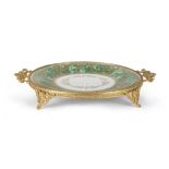 PORCELAIN DISH, 20TH CENTURY in green and gold enamel, with finishes in gilded metal. Measures cm. 5