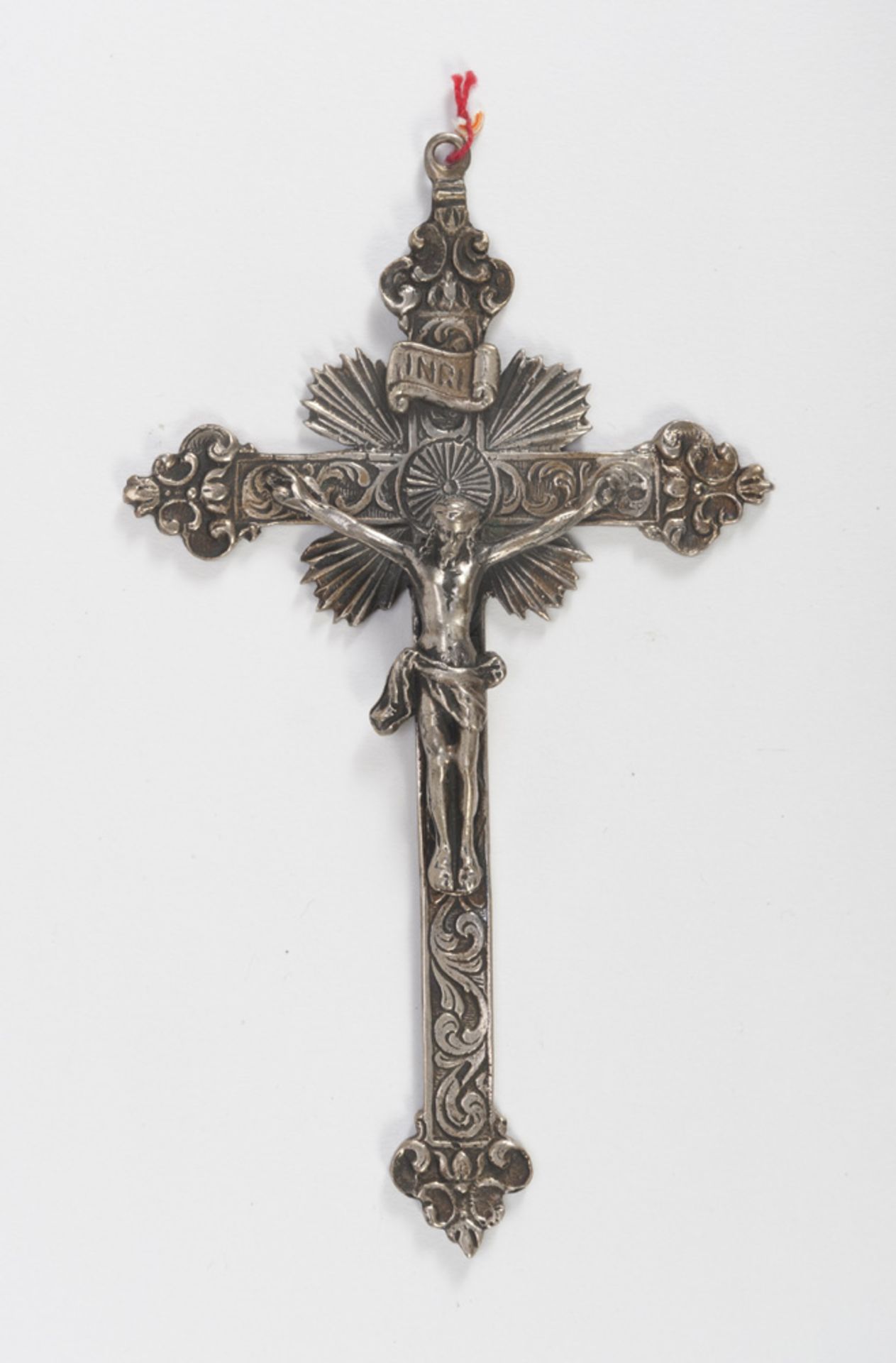 SMALL CRUCIFIX IN SILVER, LATE 19TH CENTURY with cross chiseled to plant motifs. Measures cm. 14 x