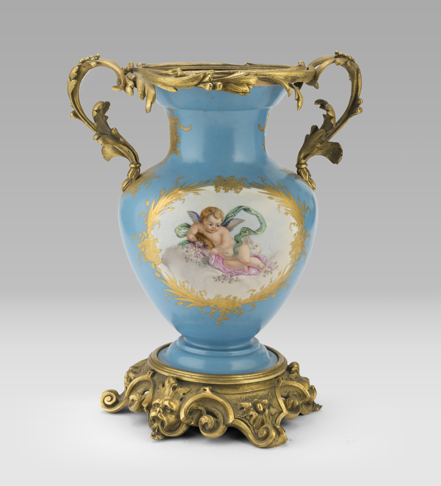 PORCELAIN VASE, SEVRES 19th CENTURY entirely in turquoise enamel, decorated with double reserves