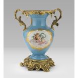PORCELAIN VASE, SEVRES 19th CENTURY entirely in turquoise enamel, decorated with double reserves