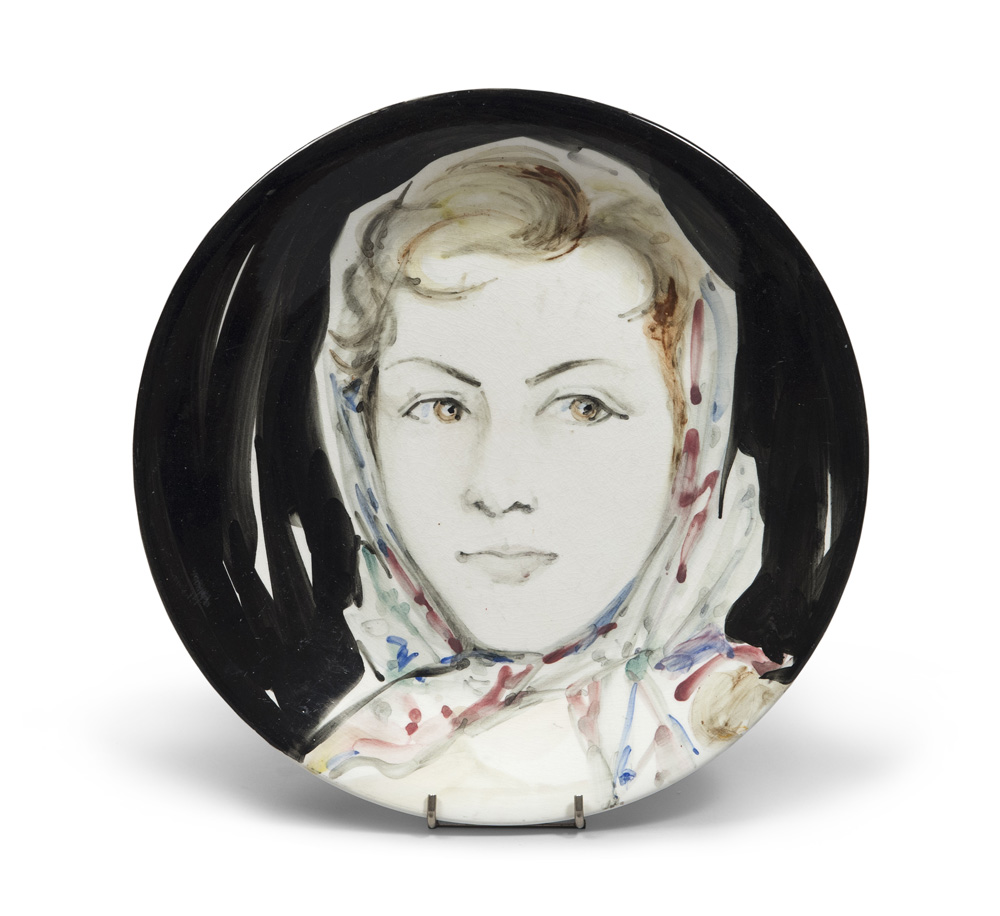 POTTER OF THE 20TH CENTURY Woman's face with handkerchief, 1959 enameled and glazed ceramic dish,