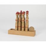 OLD TOY, 1950s miniature skittles game in carved wood. Measures cm. 23 x 25 x 8. One ball missing.