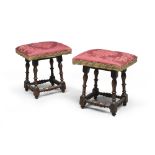 A PAIR OF STOOLS IN WALNUT, CENTRAL ITALY, 18TH CENTURY seats with upholstery in dove grey satin.