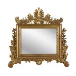 SMALL GILTWOOD MIRROR, END 18TH CENTURY with swept frame and friezes with motifs of leaves, pods and