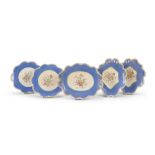 FIVE CERAMIC DISHES, LATE 19TH CENTURY in light blue enamel and polychromy decorated with flowers.