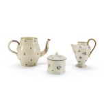 LOT OF OBJECTS IN EARTHENWARE, 19TH CENTURY consisting of two jugs and a sugar bowl. Decorated