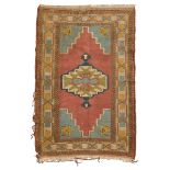 KARS CARPET, MID-20TH CENTURY with medallion in the center field on pink ground. Measures cm. 220